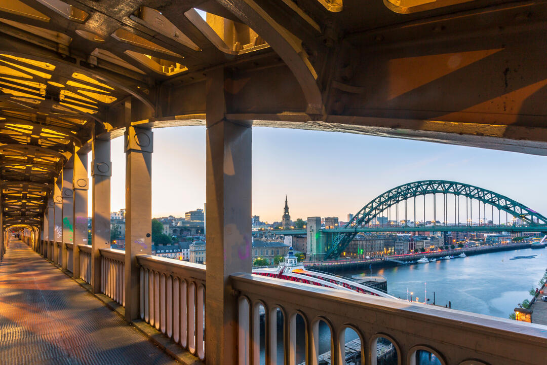 View from pedestrian level of the two bridges connecting Newcastle and Gateshead during a summer evening in June.