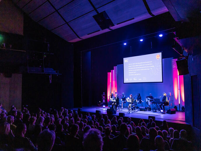 People watching a performance in a theatre