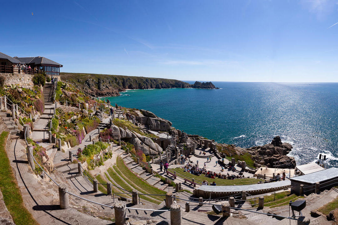 Open-air theatre overlooking the sea on a sunny day