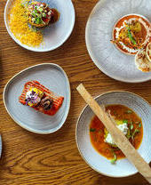 Various dishes served on a table at Prashad Restaurant in Leeds