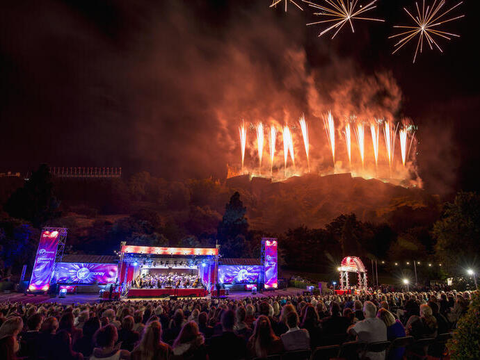 View of main stage at Edinburgh's Hogmanay event, with pyro displays in the background