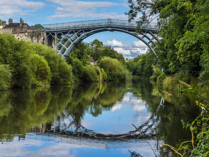 A lovely iron arched bridge over a pretty river