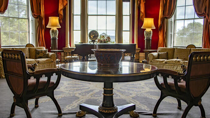 An immaculate octagonal drawing room in a stately home.