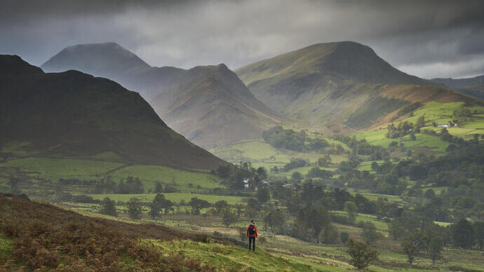 A man hiking in the hills in the autumn.