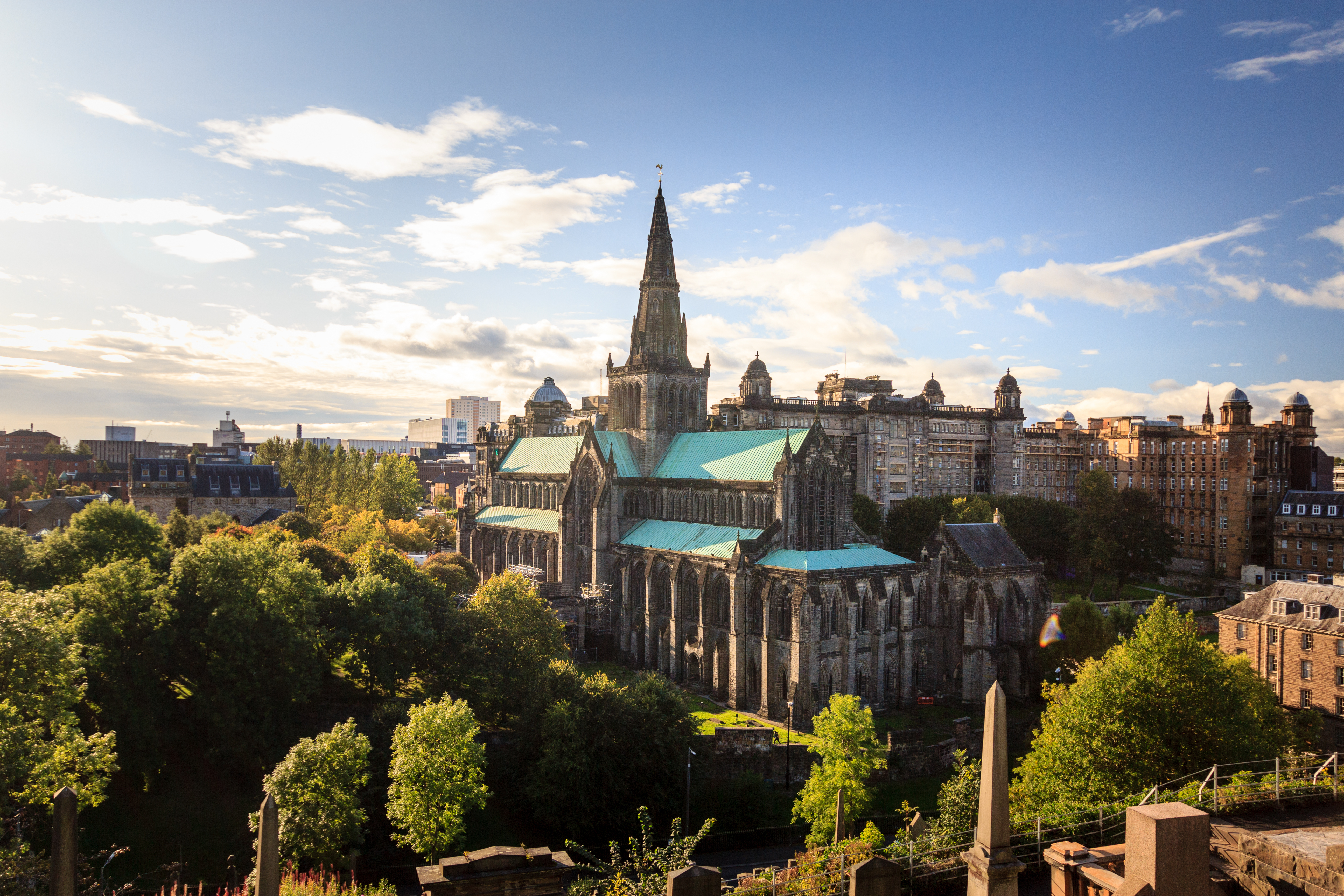 Aerial view of a cathedral on a sunny day with trees surrounding it