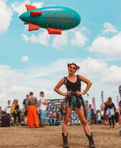 Woman standing with her hands on her hips at a music festival