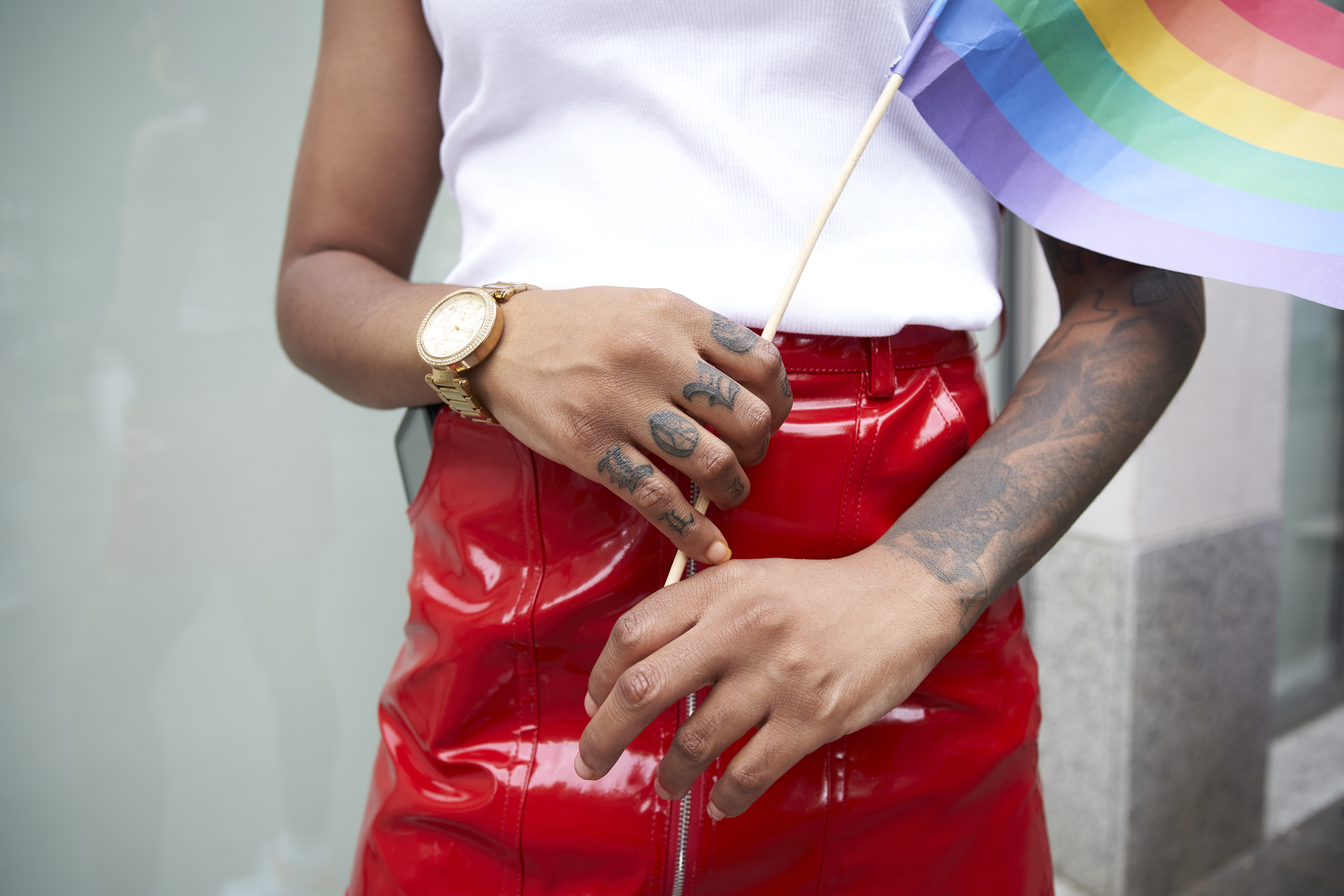 A person carrying a Pride flag