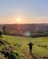 A woman looking out across a park