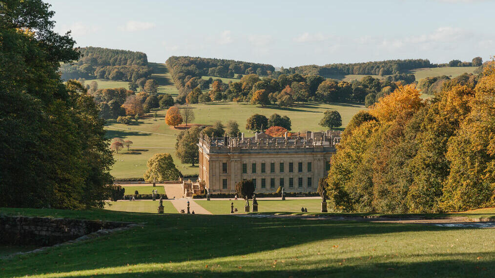 Exterior view of country house and gardens in autumn