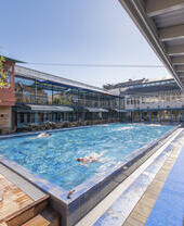 People swimming in an outdoor pool at Bristol Lido