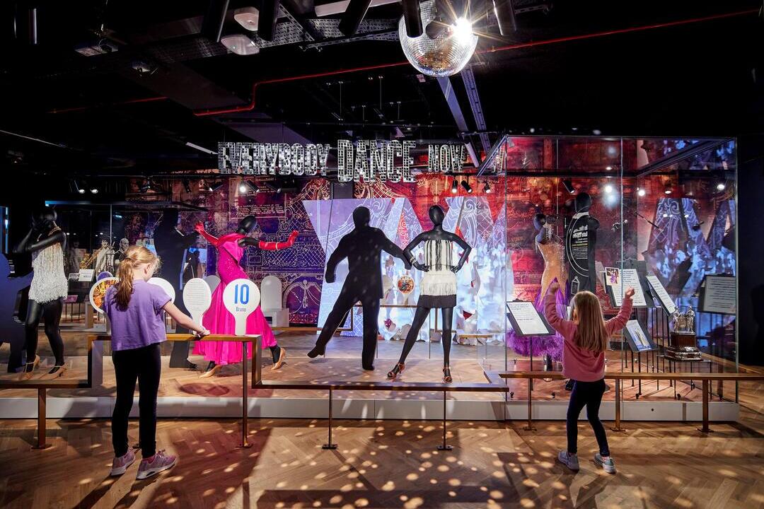 Children looking at a colourful museum exhibit.
