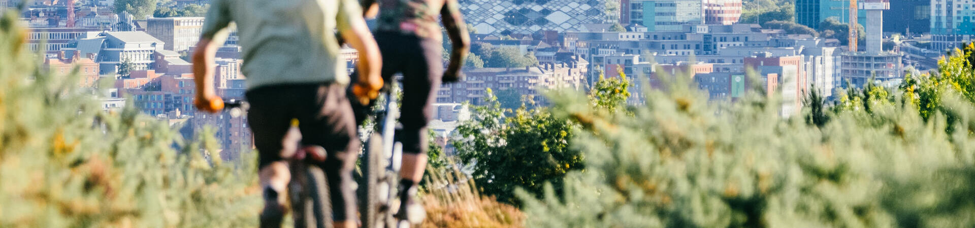 People riding bikes on the inner city mountain bike trails at Parkwood Springs, Sheffield