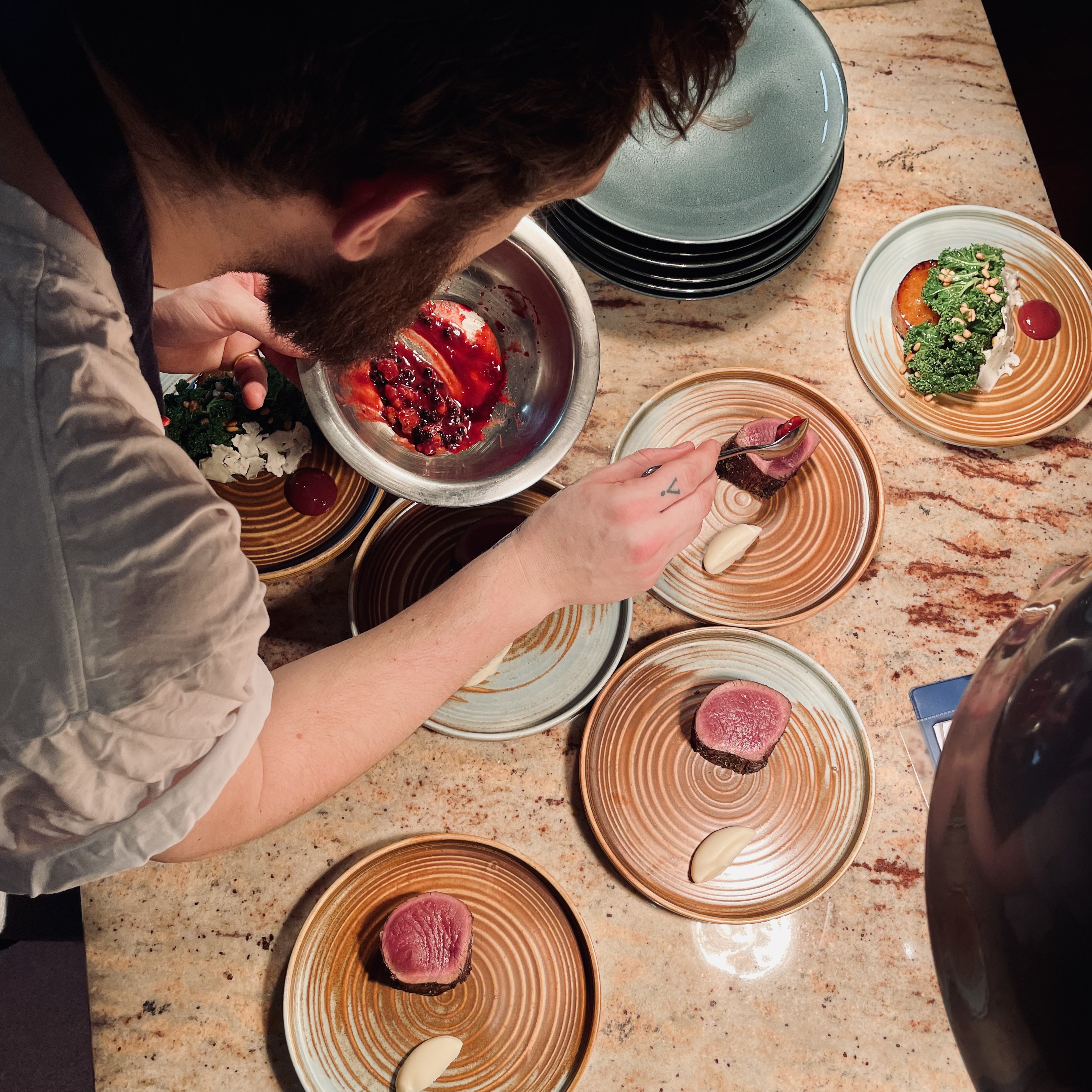 A chef plating up food in Brighton's highly rated Kindling Restaurant