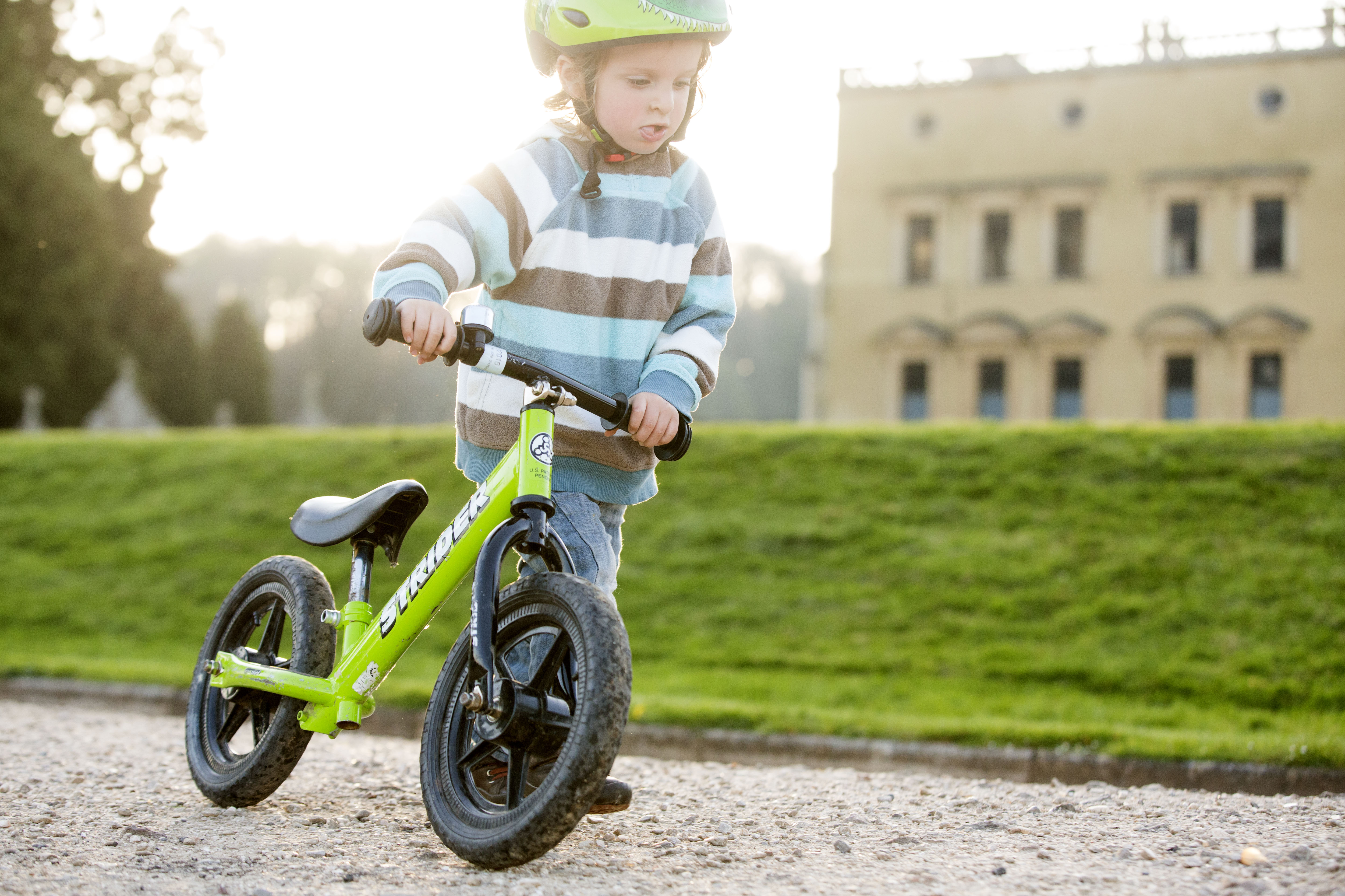A child riding a bike outside Ashton Court in Bristol
