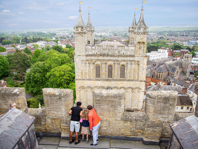 Aerial view of people looking down from a tower at Exeter Cathedral