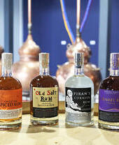 Bottles of Cornish Rum lined up on a table