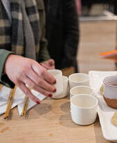 Cups of tea and Japanese gyoza being served at a restaurant in Bath