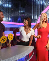 A couple enjoying waxworks at Madame Tussauds Blackpool.