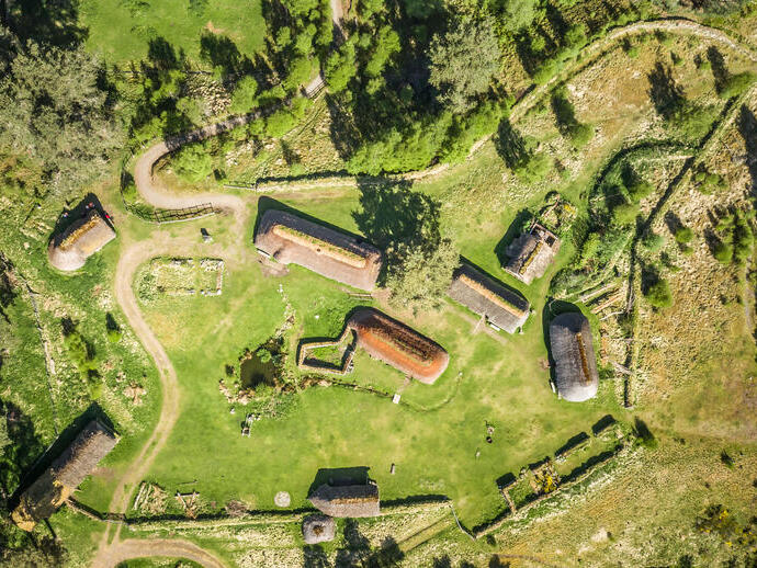 Overhead view of historic huts compound in the countryside
