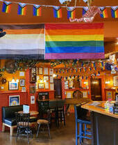 A series of pride and LGTBQ+ flags on display at the Regent Bar in Edinburgh