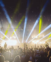 A band performing on stage at Rattler Festival in Cornwall