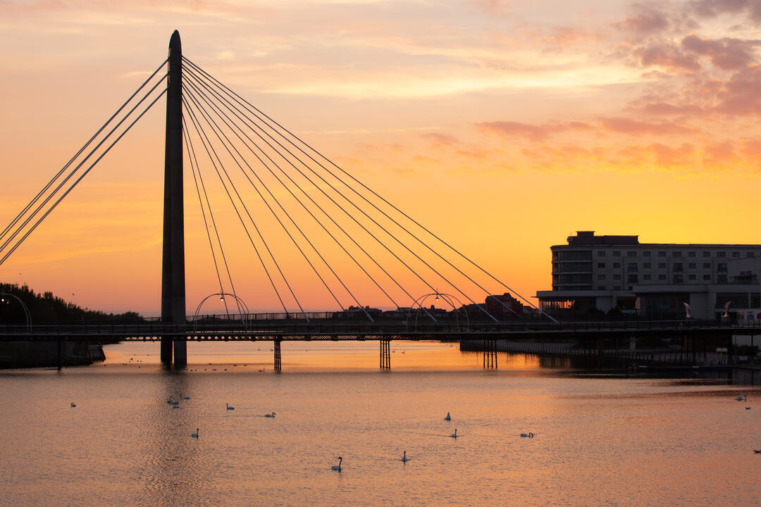 View of sunset over a lake in a seaside town