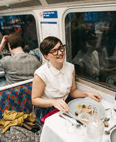 A group of people dining on the Supper Club Tube, a gourmet restaurant built into an underground tube train