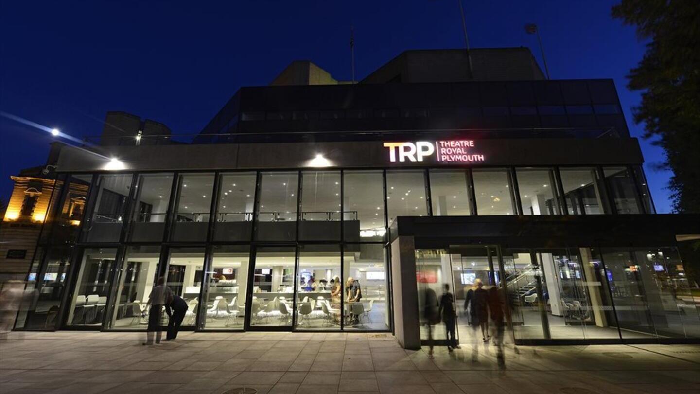 An outdoor nighttime view of the Theatre Royal Plymouth