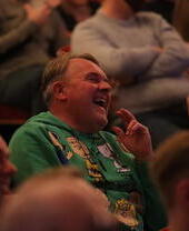 An audience member laughing during a show at Leicester's Comedy Festival