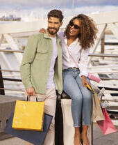 Two people with shopping bags
