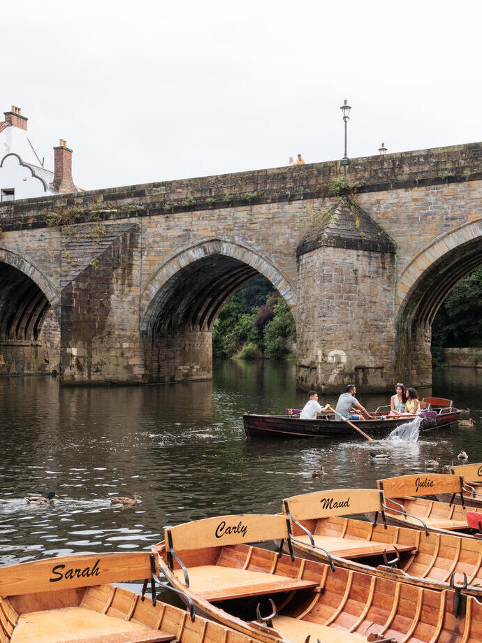 A family rows along the River Wear in a rented boat