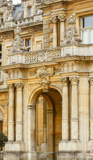 Couple walking outside a stately home