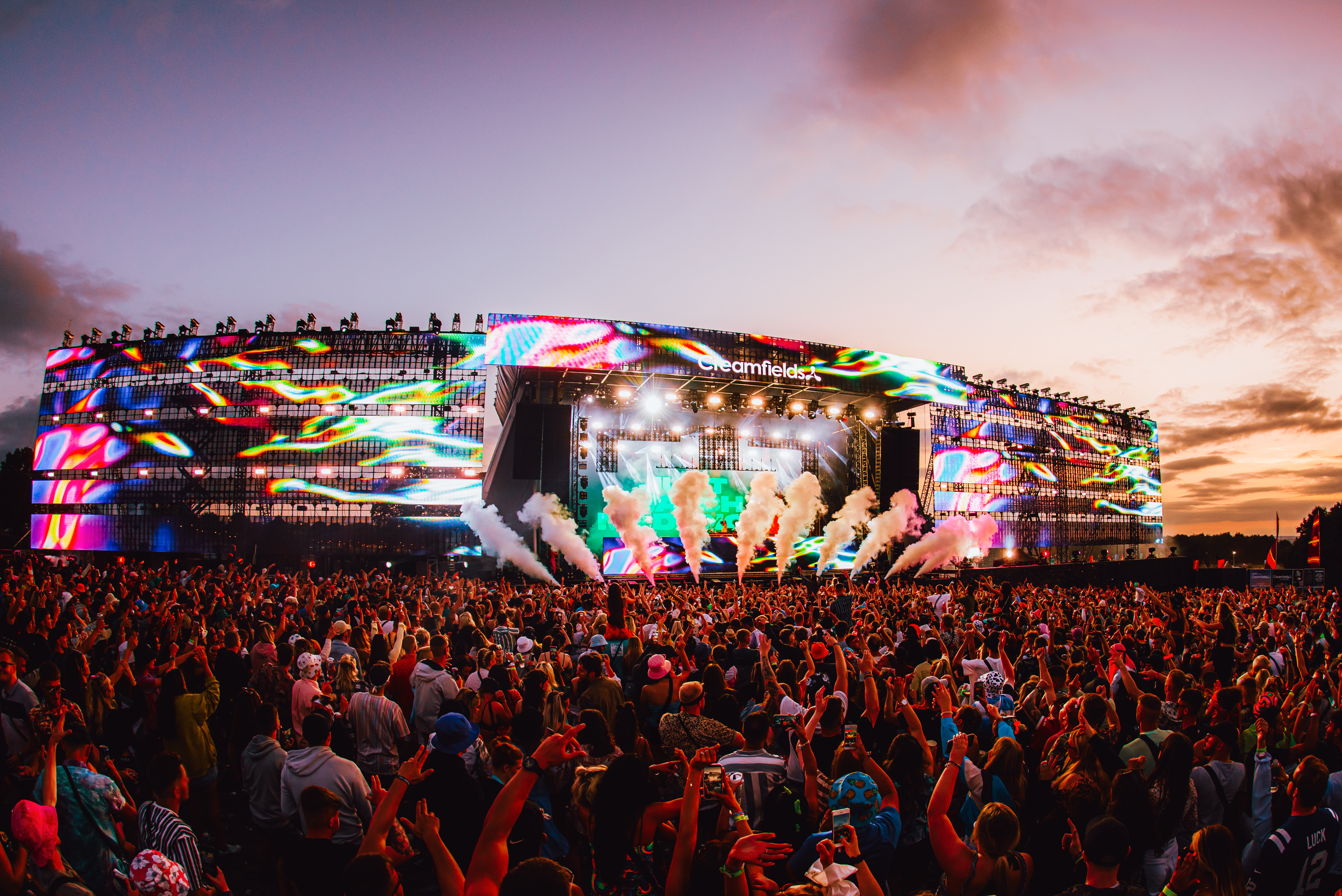 Crowd in front of the main stage at a music festival