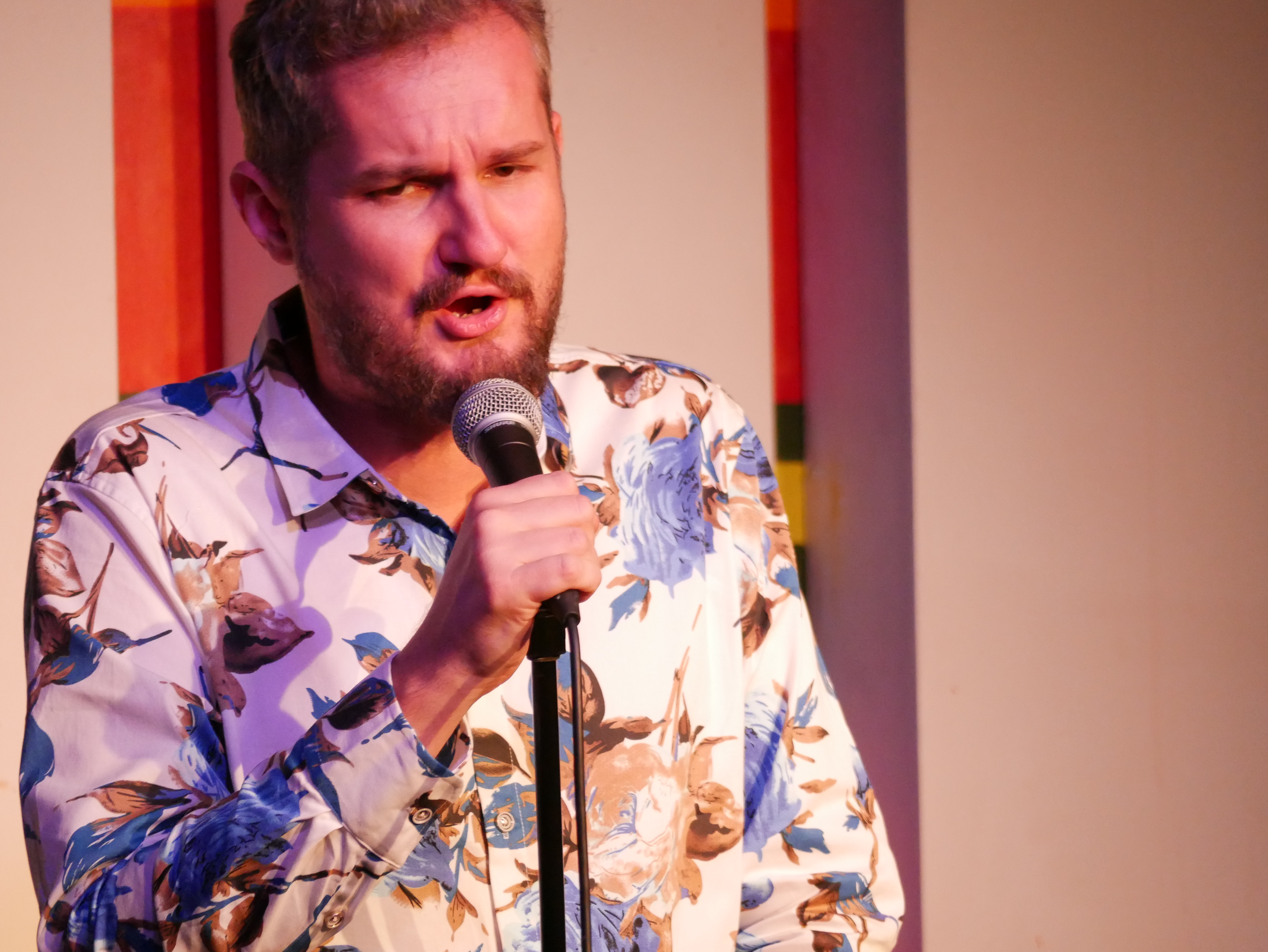 A man with a microphone at Birmingham Comedy Festival (autumn)