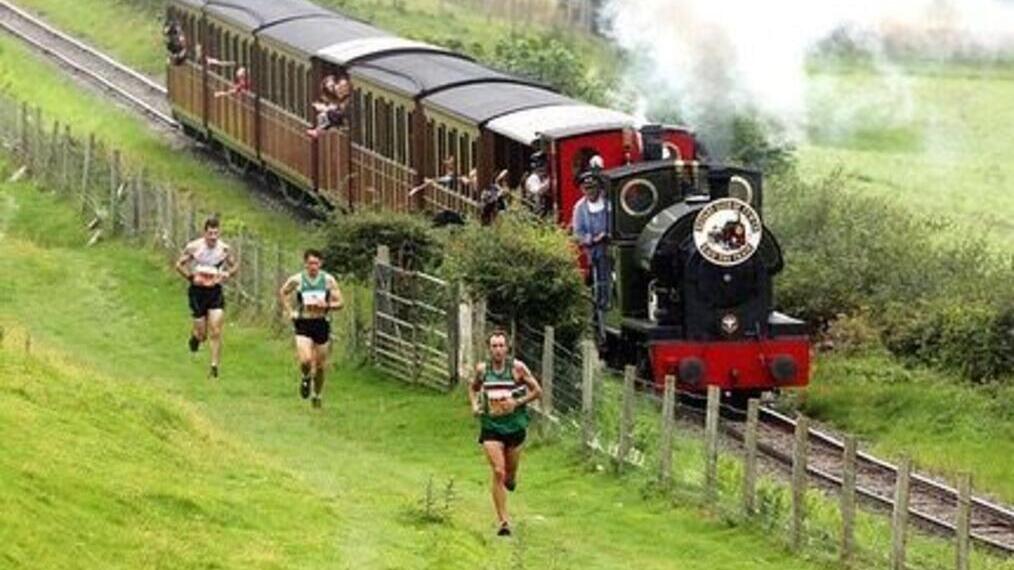 Race The Train event showing participants racing alongside a steam train in Wales
