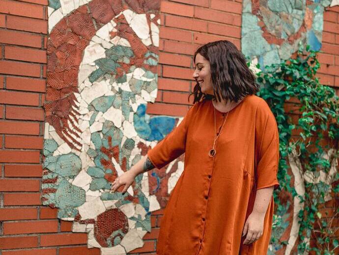 Standing infront of a mural