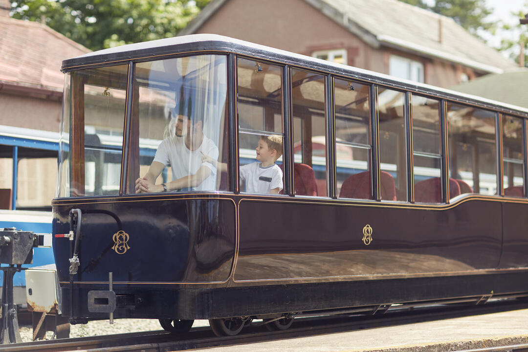 Heritage train with two people inside