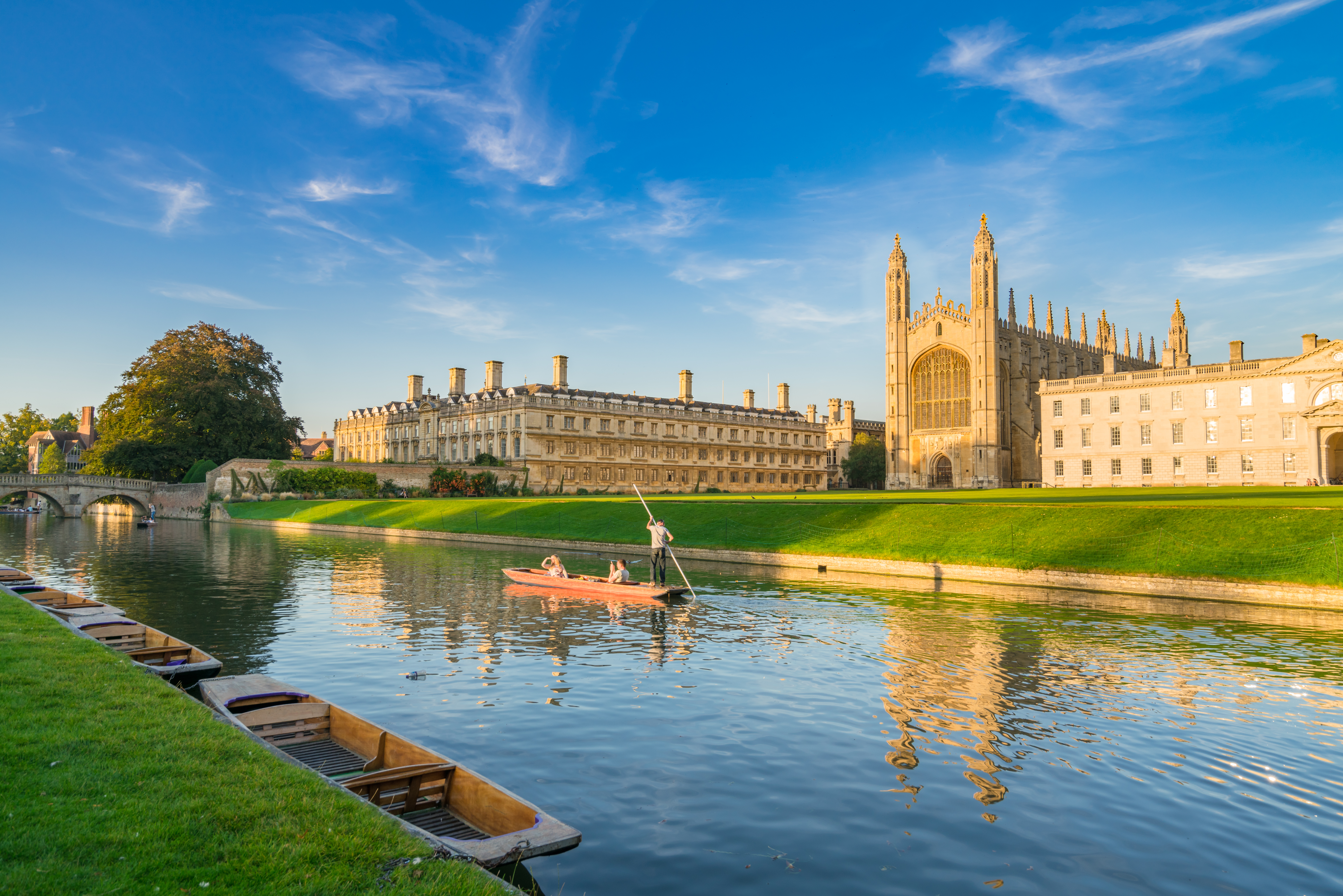 View of college in Cambridge with people punting on River