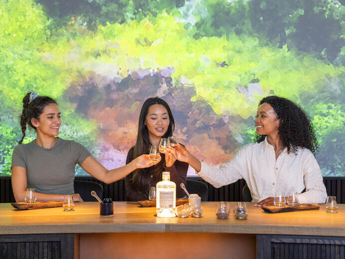 Three women having a tasting session at a whisky distillery